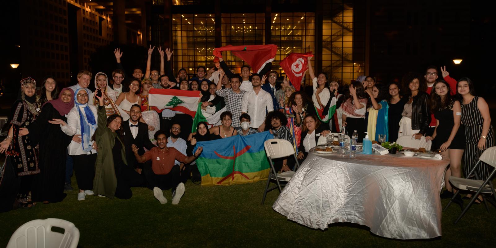 A group pf boys and girls with flag