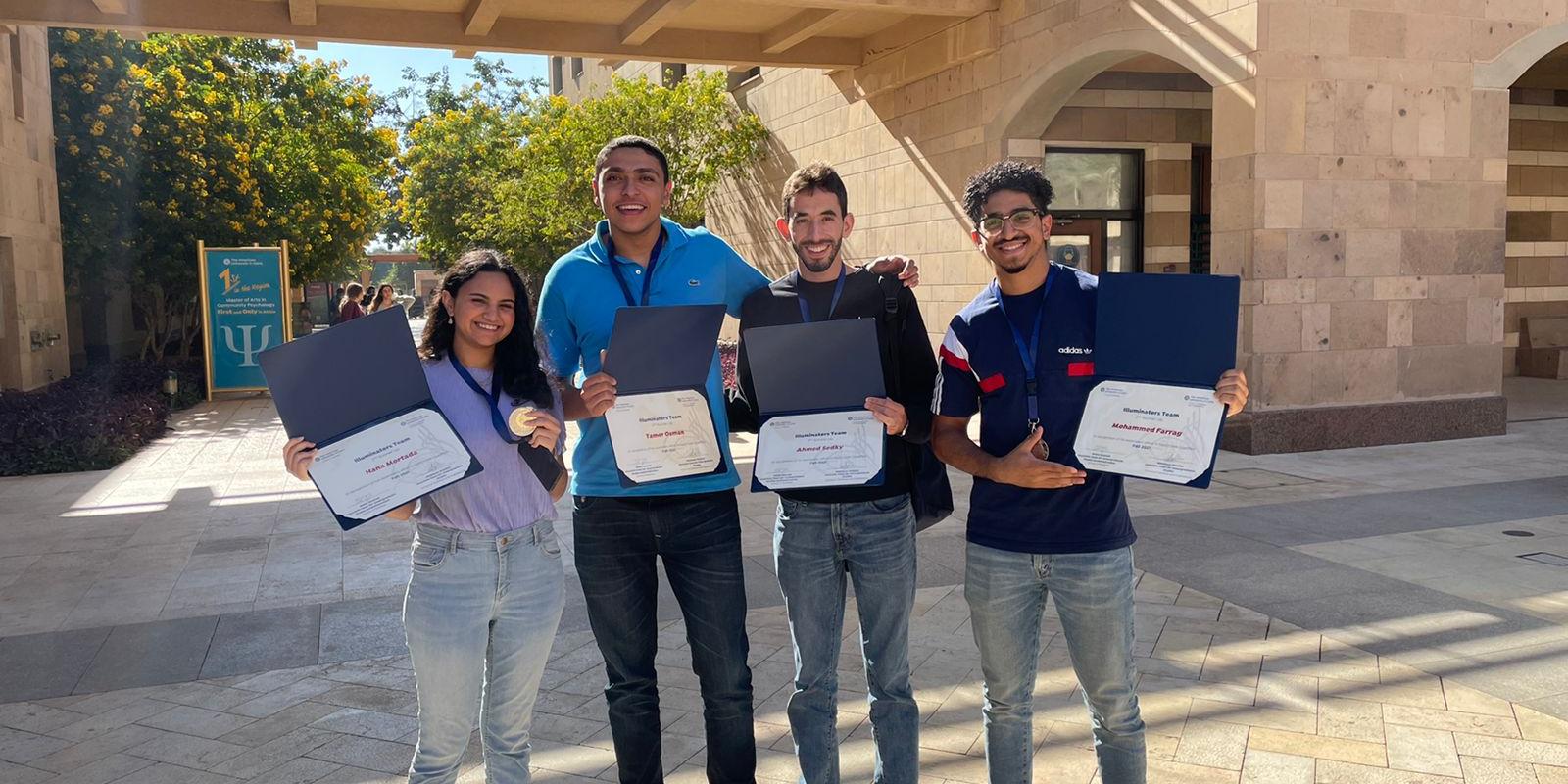 Girl and boys holding certificate