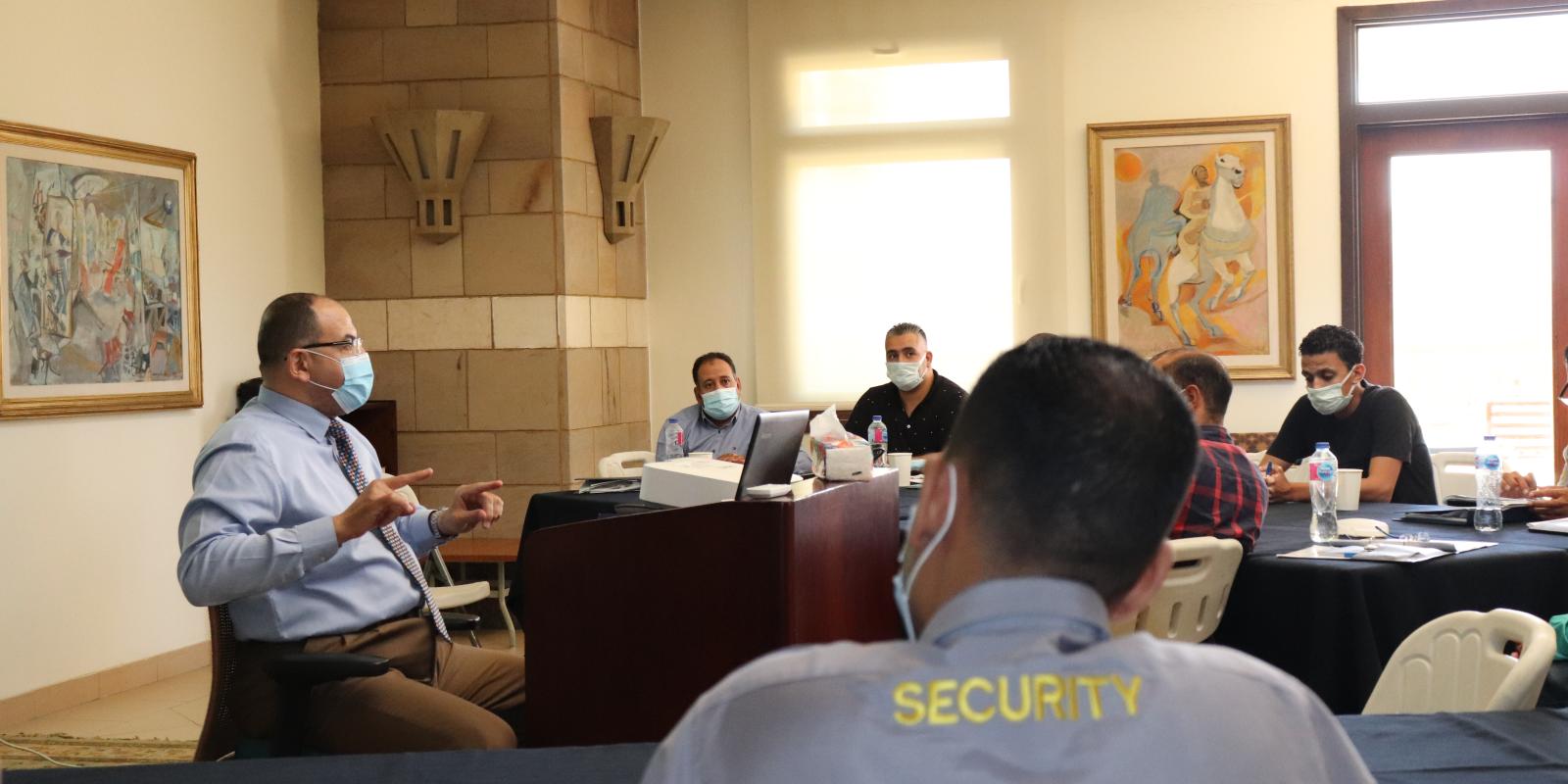 Security guards attend a class led by the School of Continuing Education