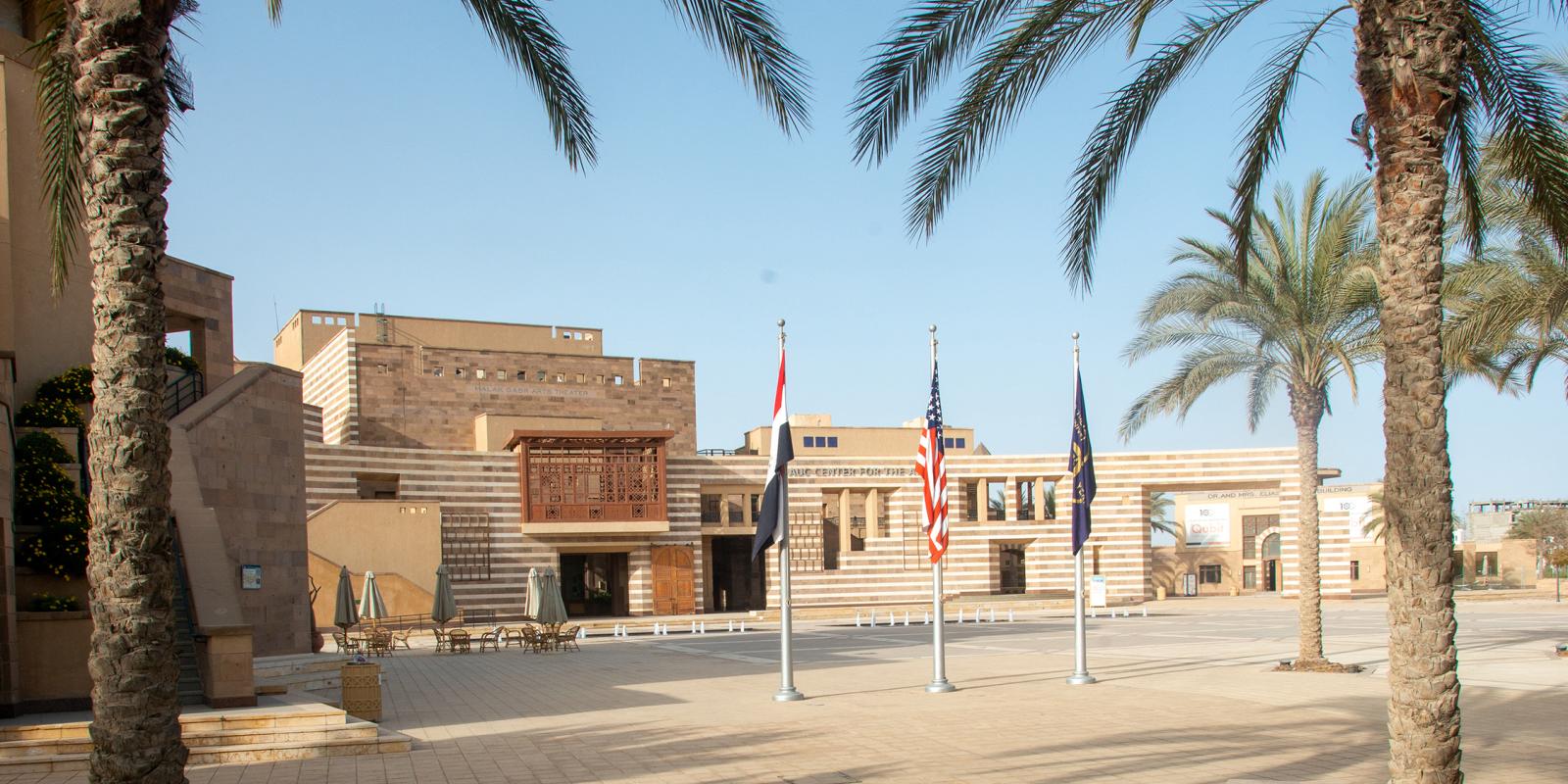 American, Egyptian and AUC flags at Gate 1 entrance