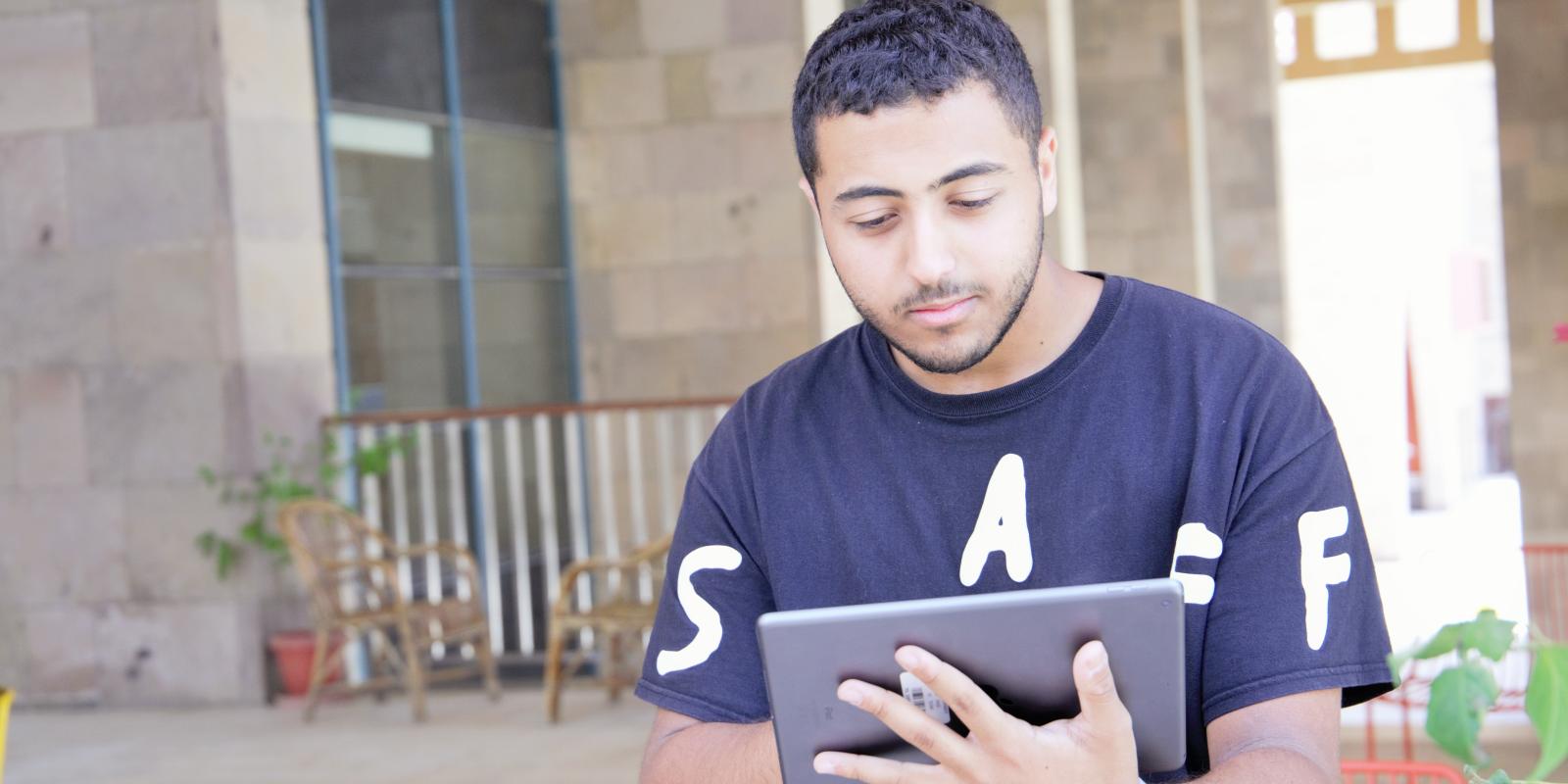 Boy working on an Ipad