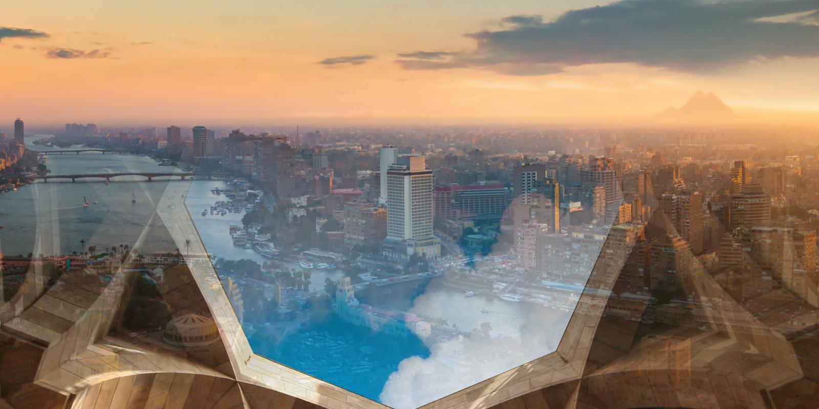 aerial view for Cairo with clouds and AUC architecture in the background, to represent climate change initiative 