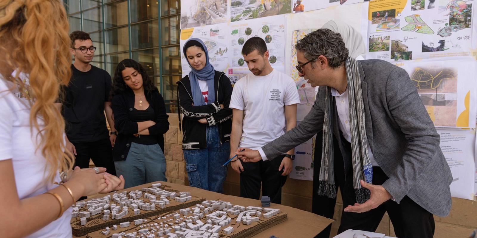 Professor explaining about buildings to students