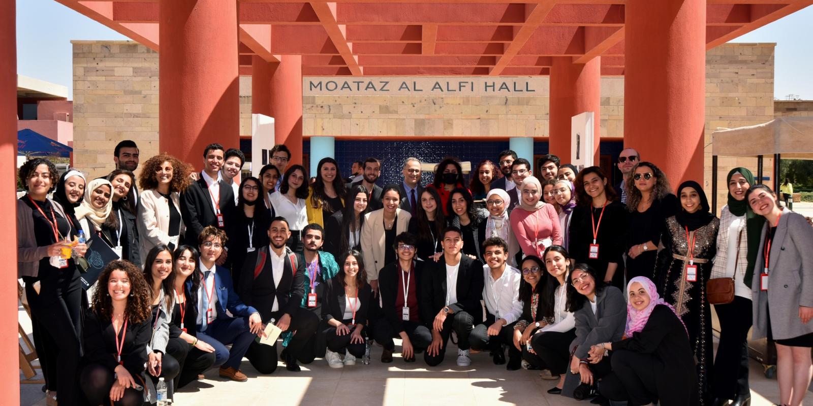 A group photo of TL students and staff with AUC President