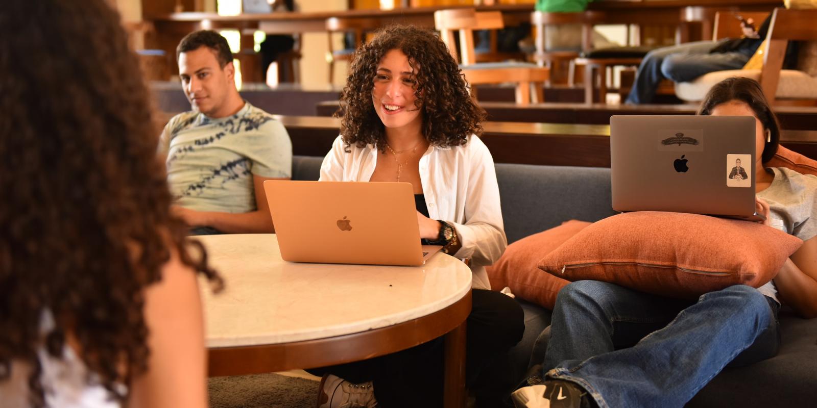 Student on her laptop smiling