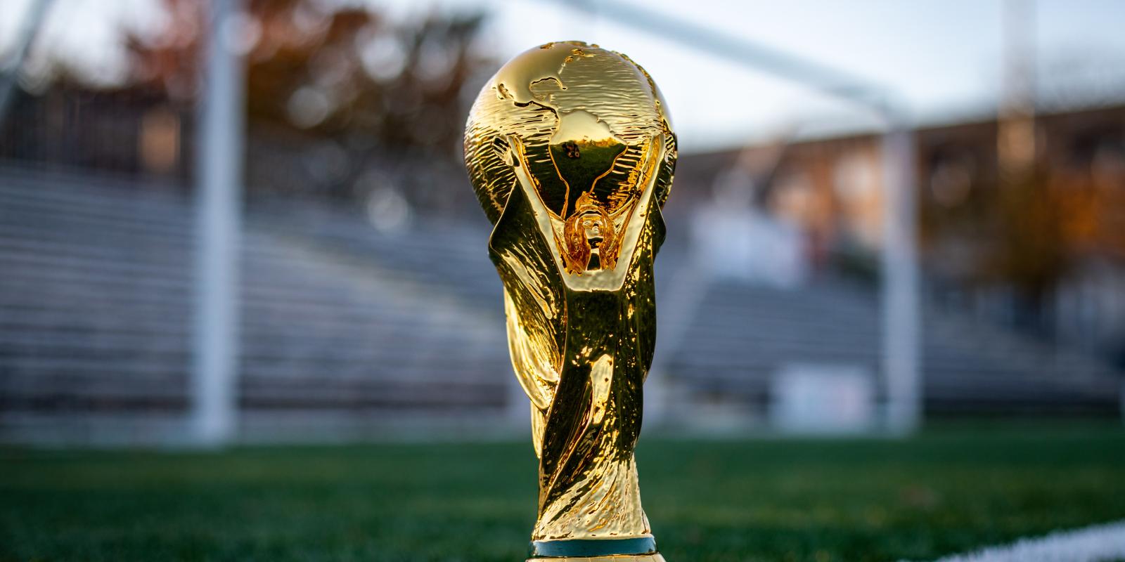 World cup trophy on a football field