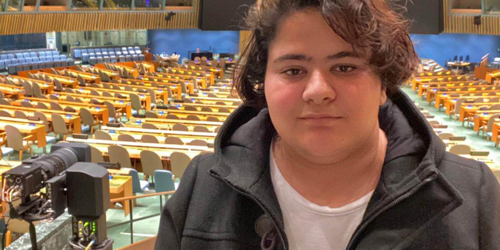 a boy in an auditorium