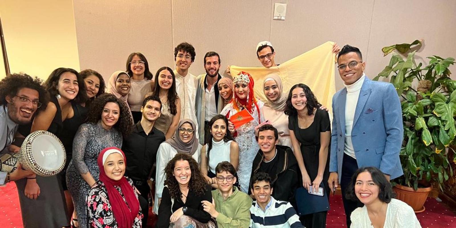 A group of girls and boys smiling