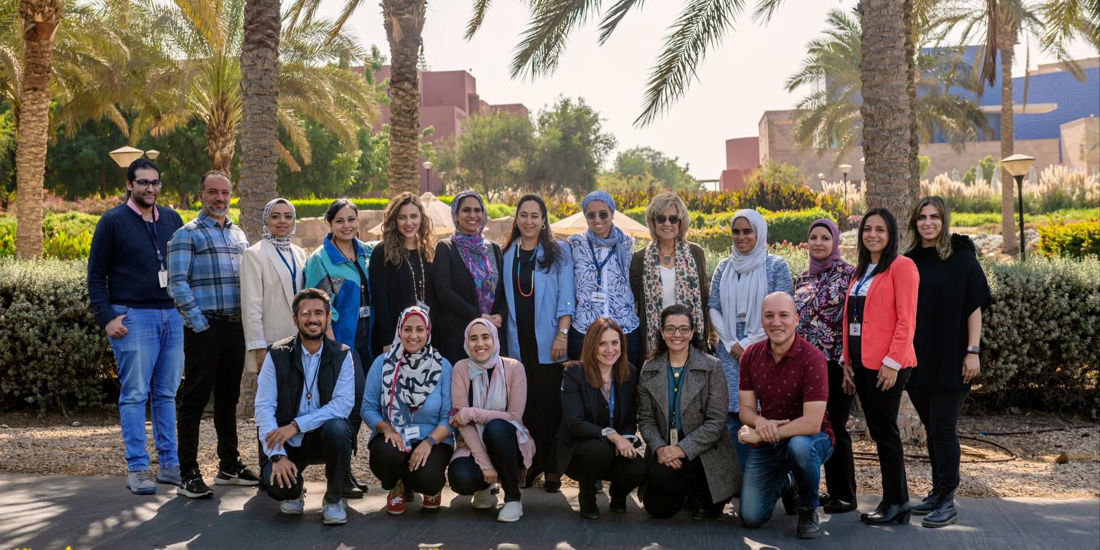 Group of people posing in the AUC Gardens