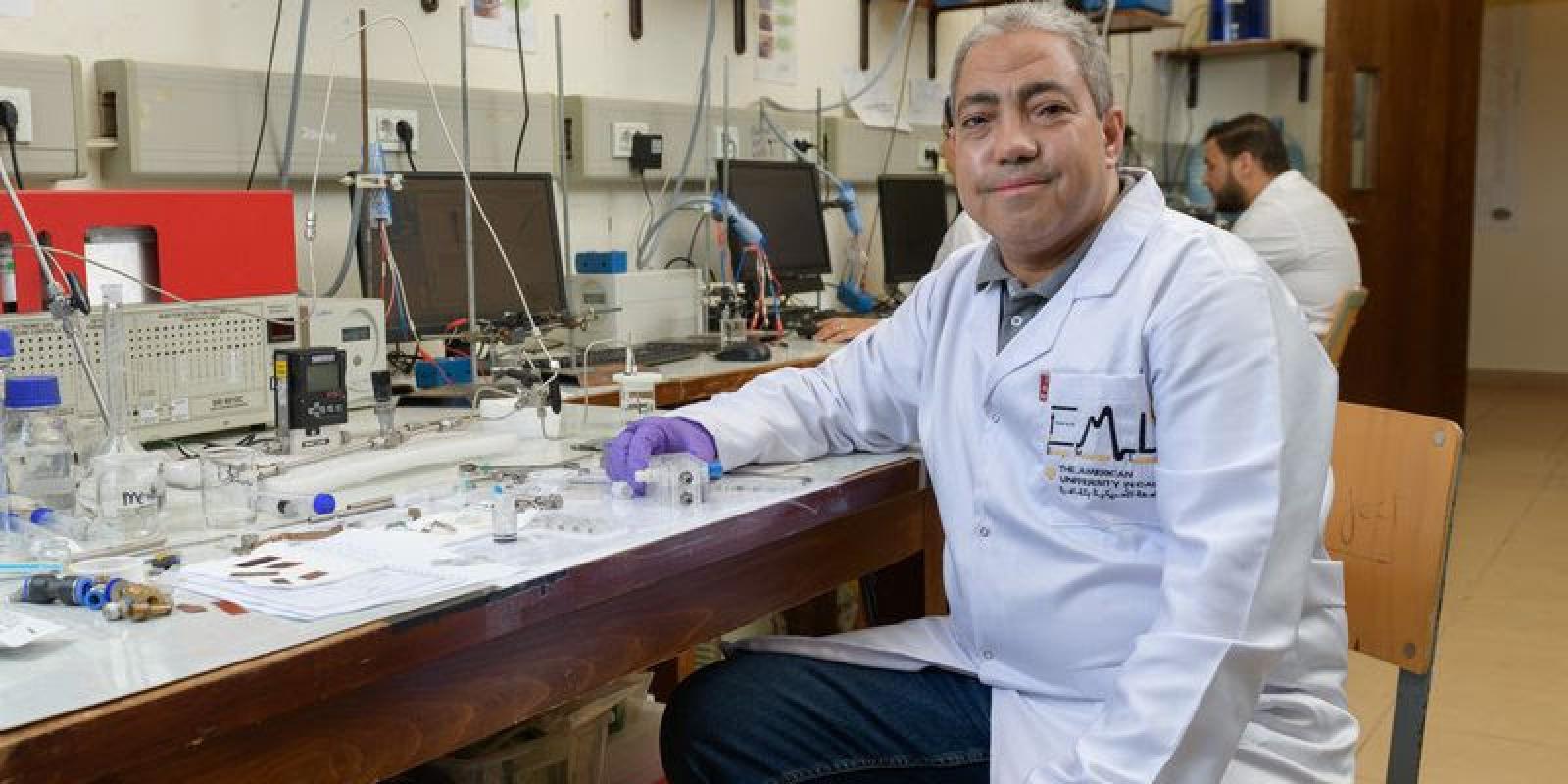 A scientist sitting in a lab