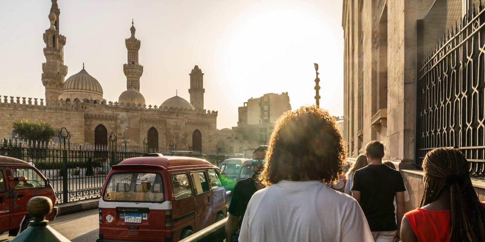 A photo of a Cairo street, taken from Abdelhalim. Al Azhar mosque sits to the left and the wall of Khan al Kalili is on the right. 