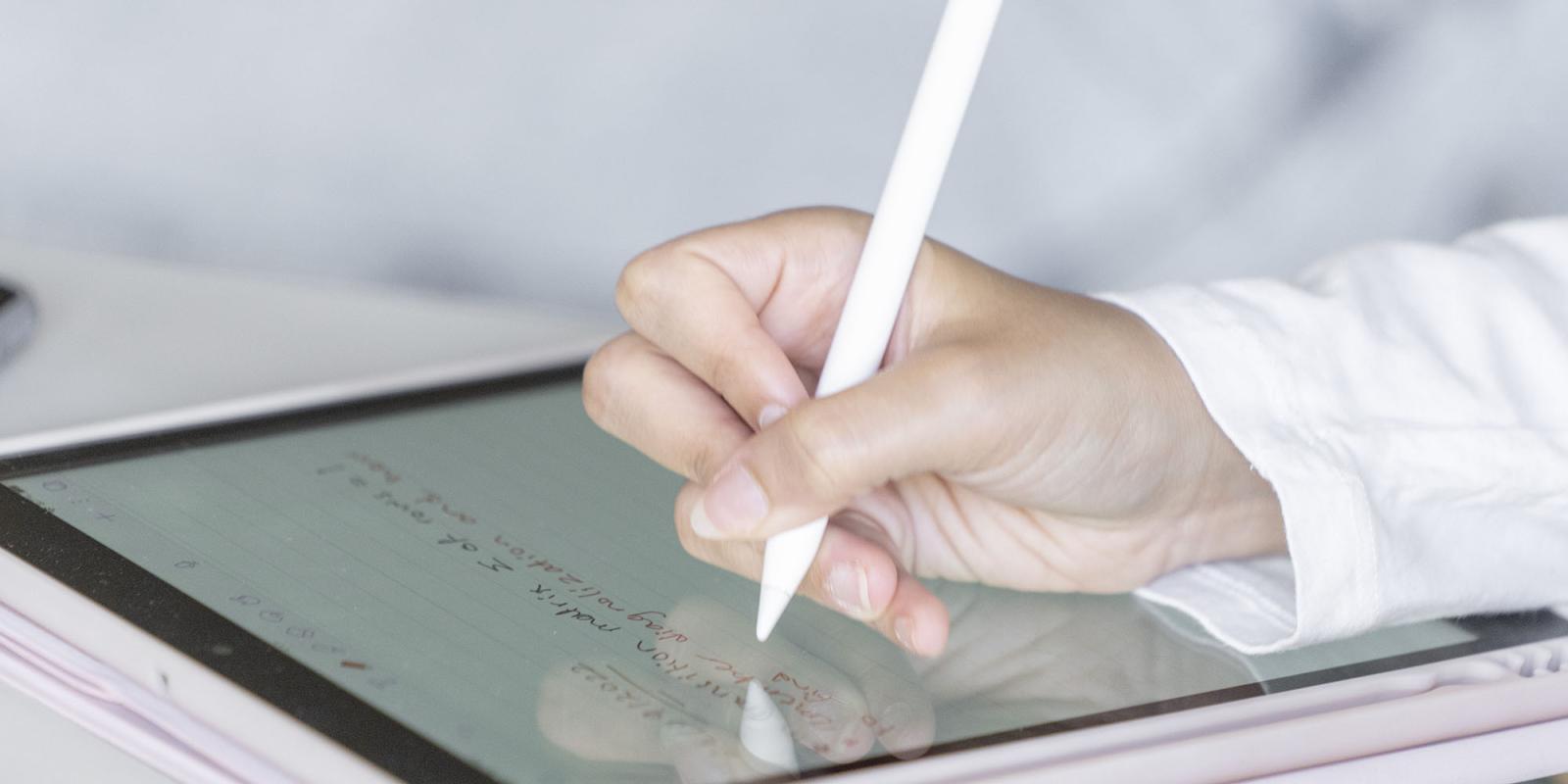 Hand writing on a tablet
