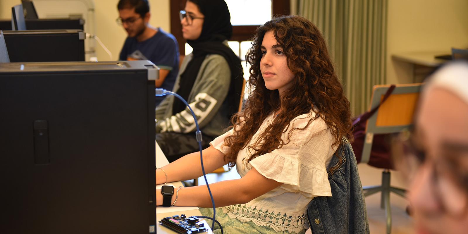 Students siting in a computer lab