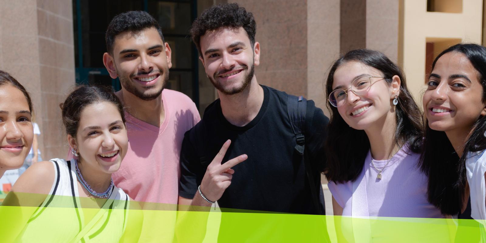 A group of girls and boys smiling