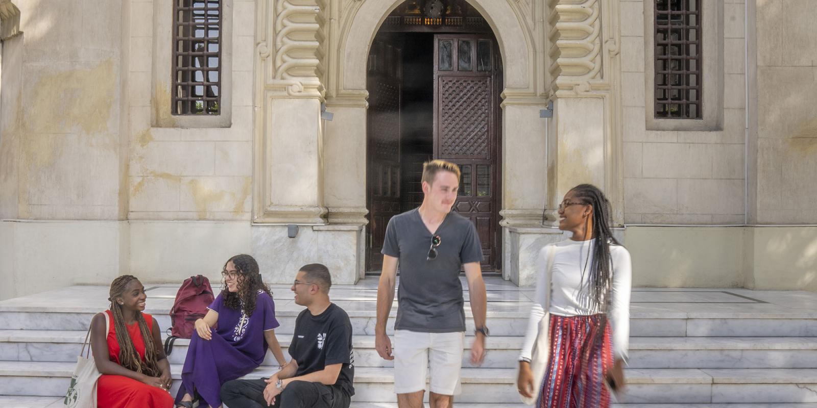 Inclusive and Comparative Education banner image of international students walking in front of a historic site
