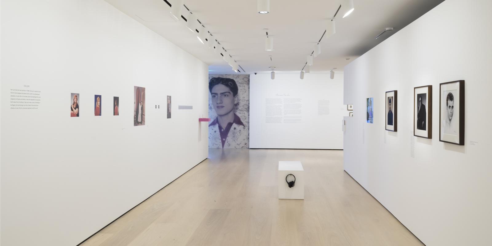 Inside of the Hammer Museum, displaying photographs taken by Van Leo on white walls