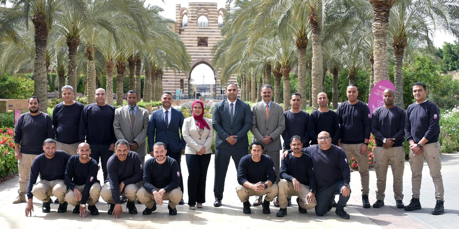 Group photo of men and women taken outdoor