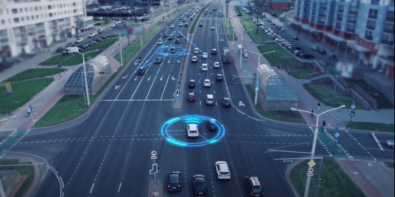 A photo of a street with cars, with blue graphic visualizations of automated vehicle technology