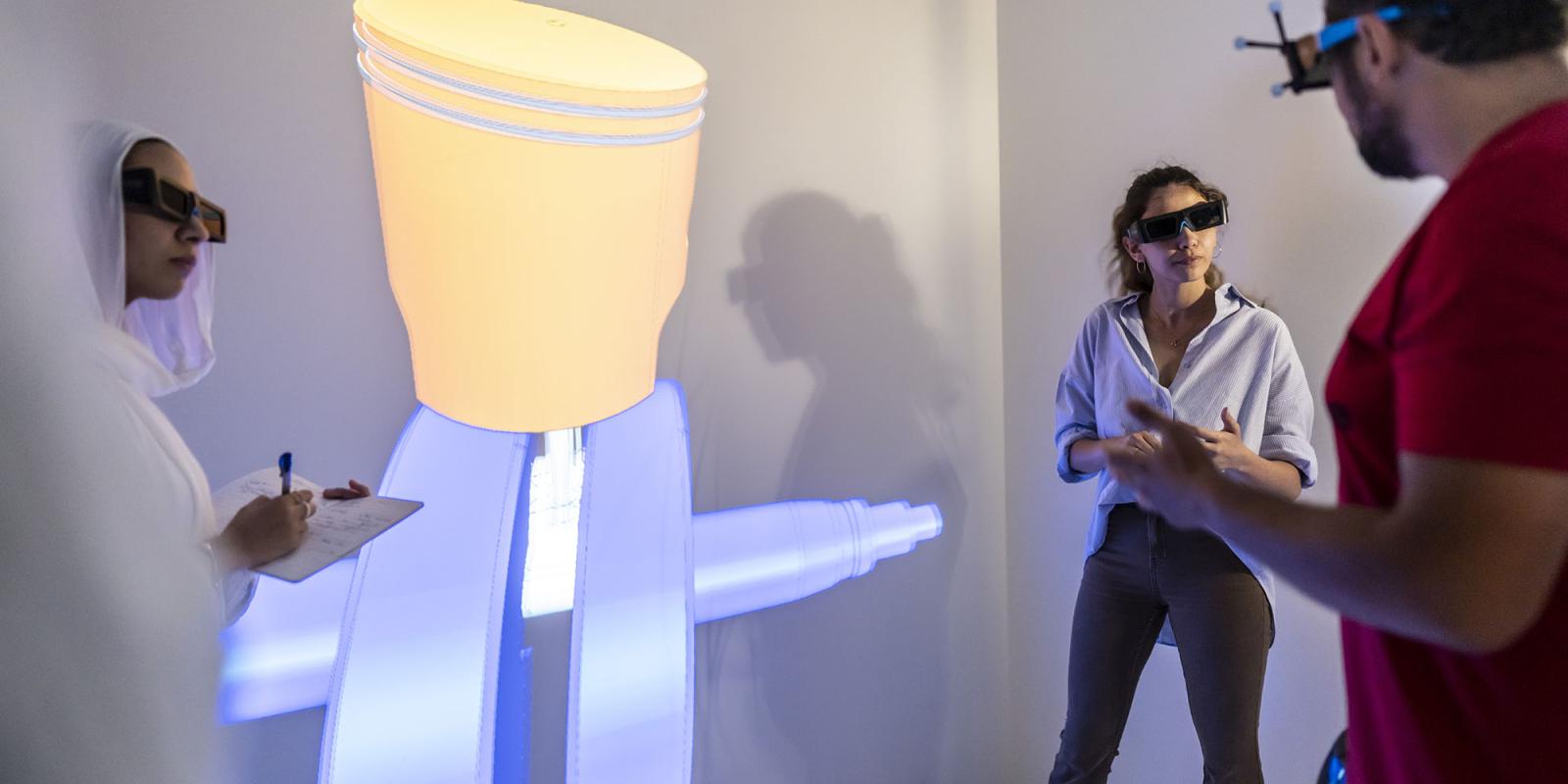 Students in a vr lab with large screens
