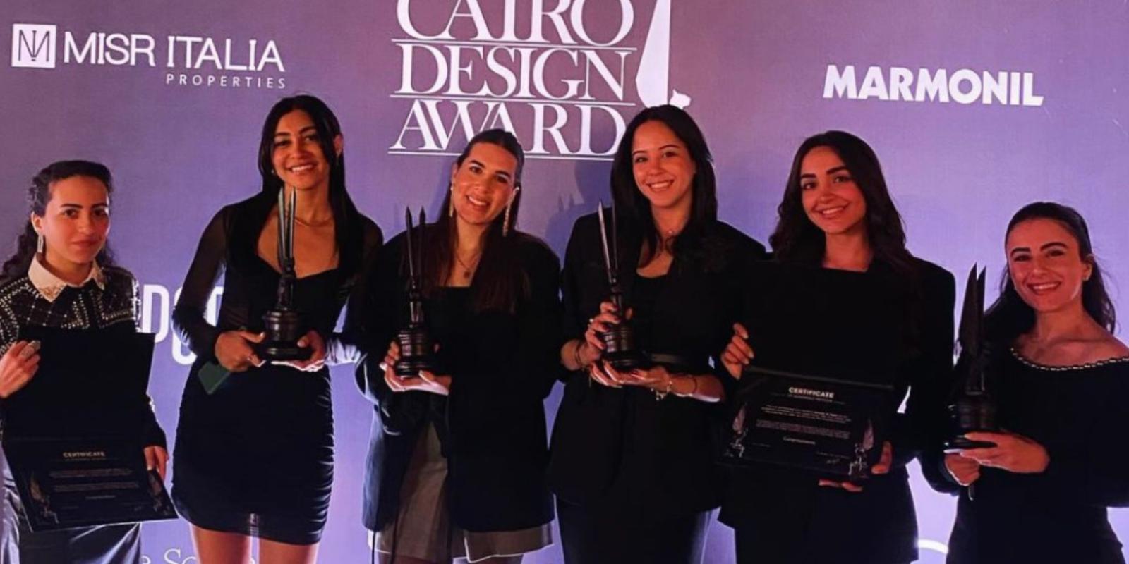 Alumni pose with various awards at Cairo Design Week