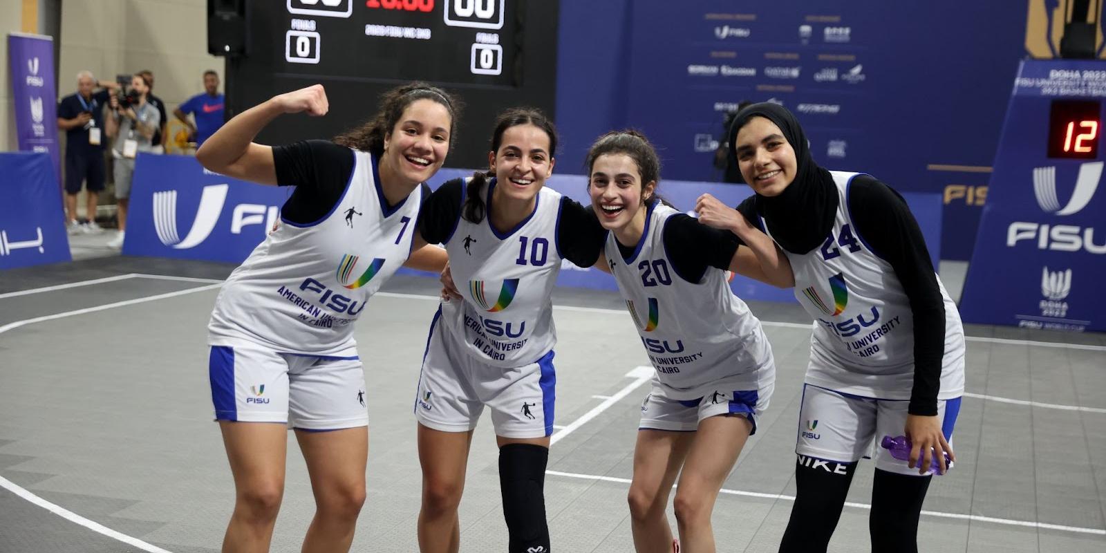 4 women basketball in the field 