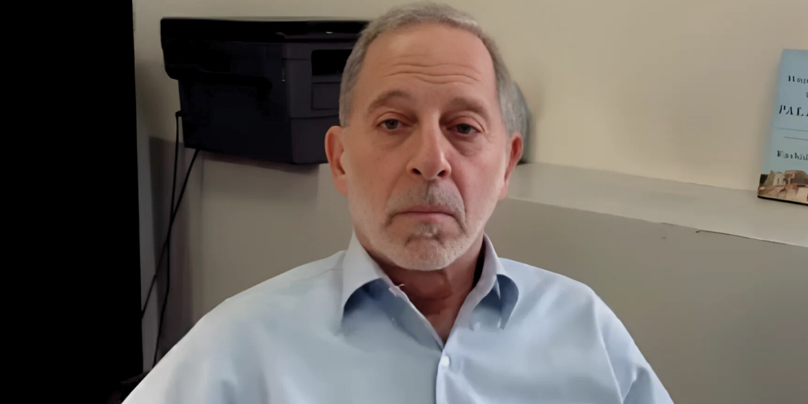 Rashid Khalidi sitting at his desk through a Zoom screen