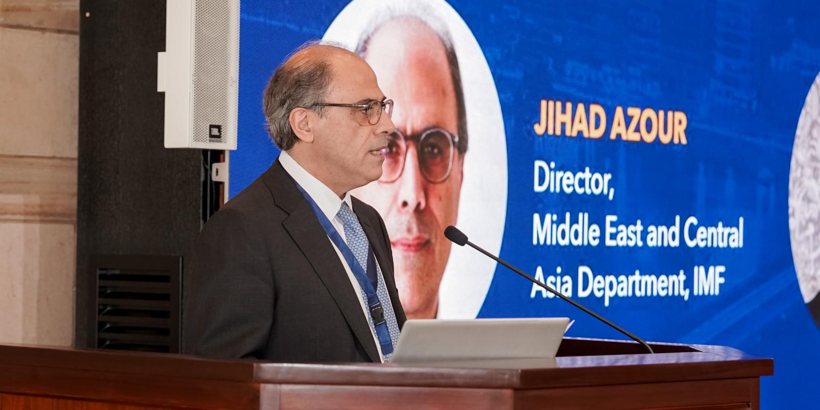 IMF Director Jihad Azour speaking at an AUC podium