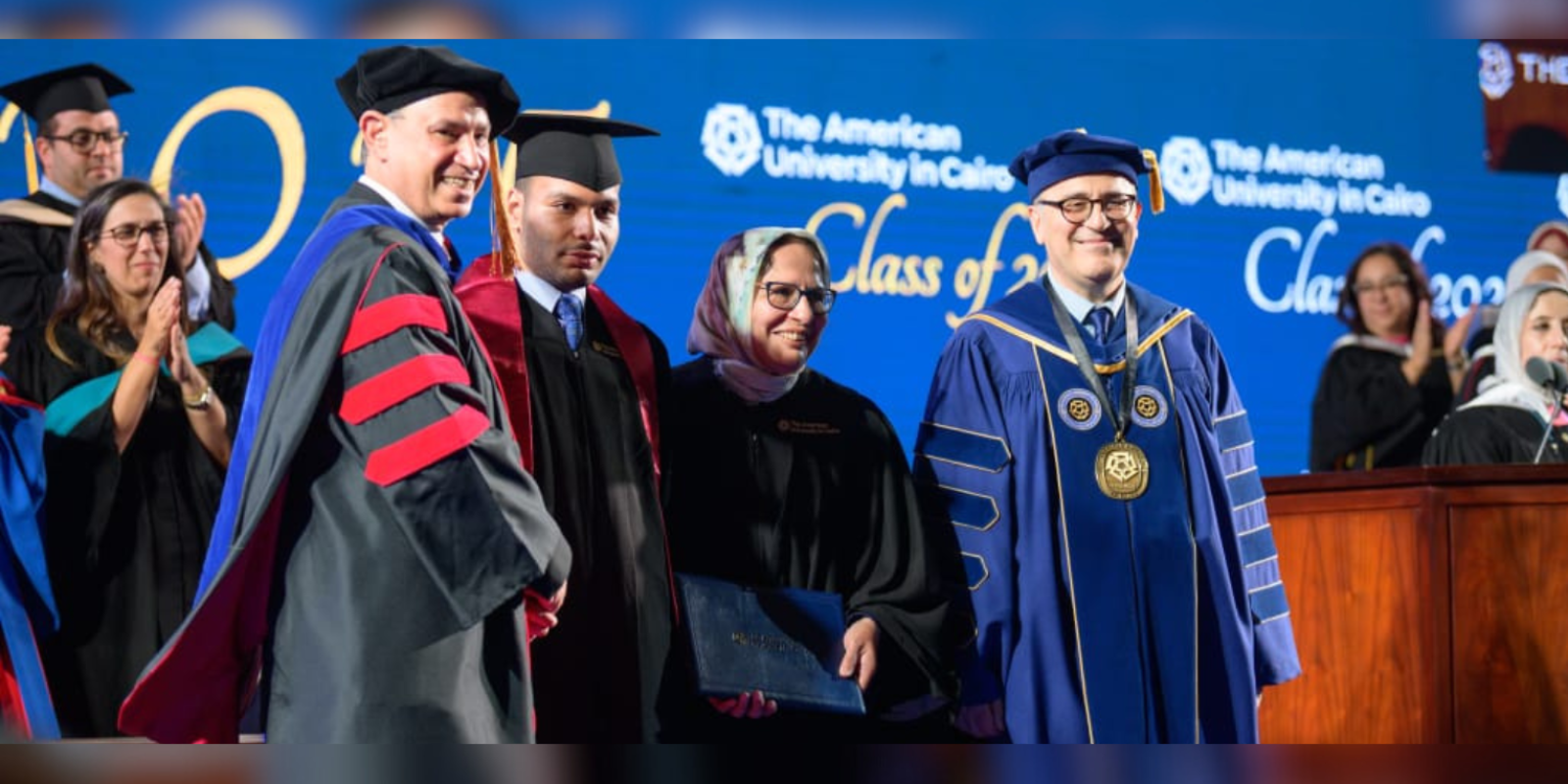 Zaydan family receiving degrees at graduation