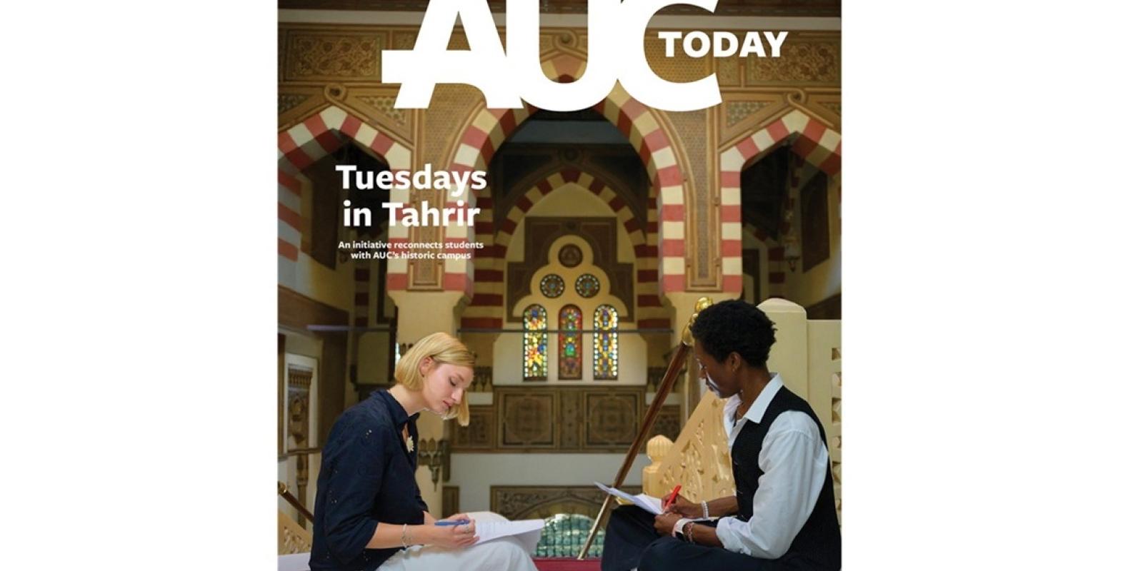 Two females are sitting on the floor. They are writing. Text: AUCToday. Tuesdays in Tahrir