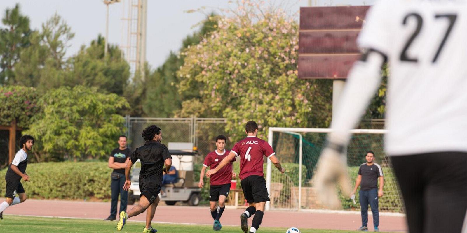 auc football team playing a match in the football field