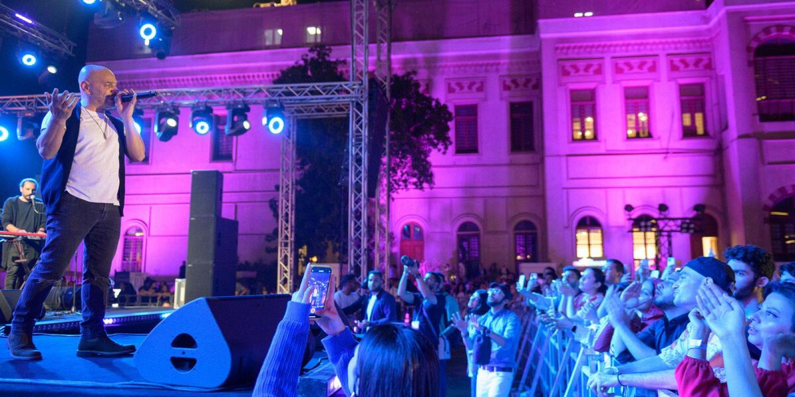 concert at auc tahrir square with performers on stage