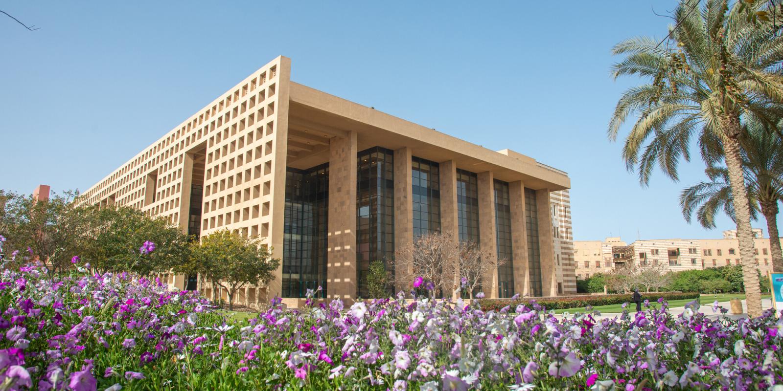 library in the spring with garden and flowers blooming