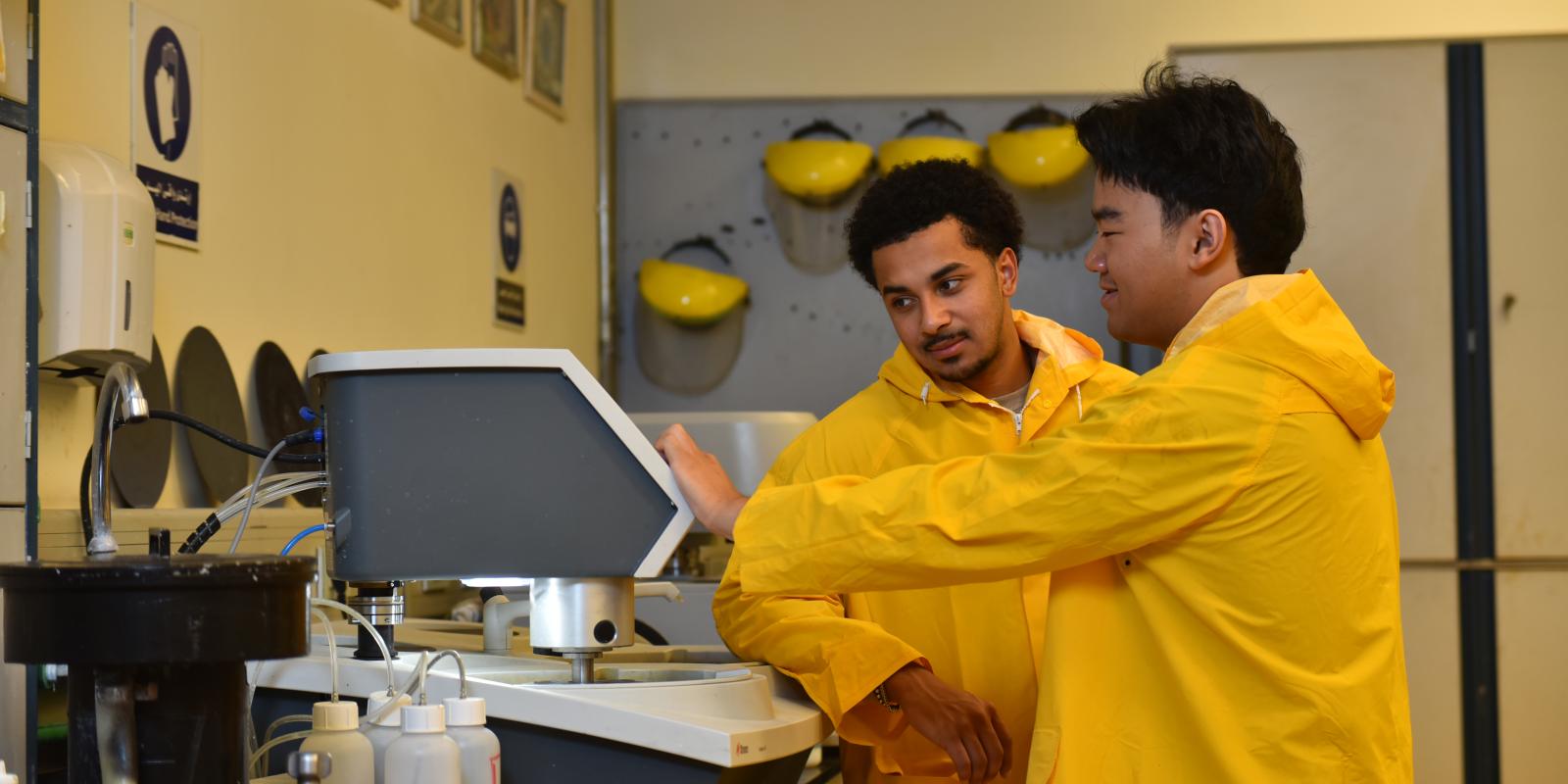 Yusef Primus and Anthony Nguyen work in a manufacturing laboratory
