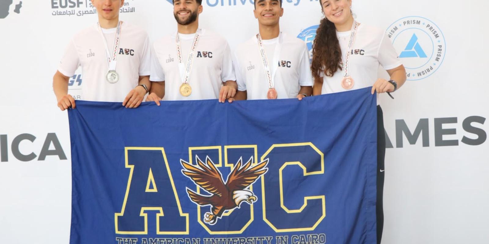 AUC Winning Students holding the AUC Flag