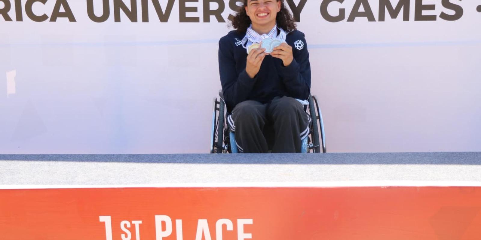Winner of First Place in Para Swimming Holding Her Medals
