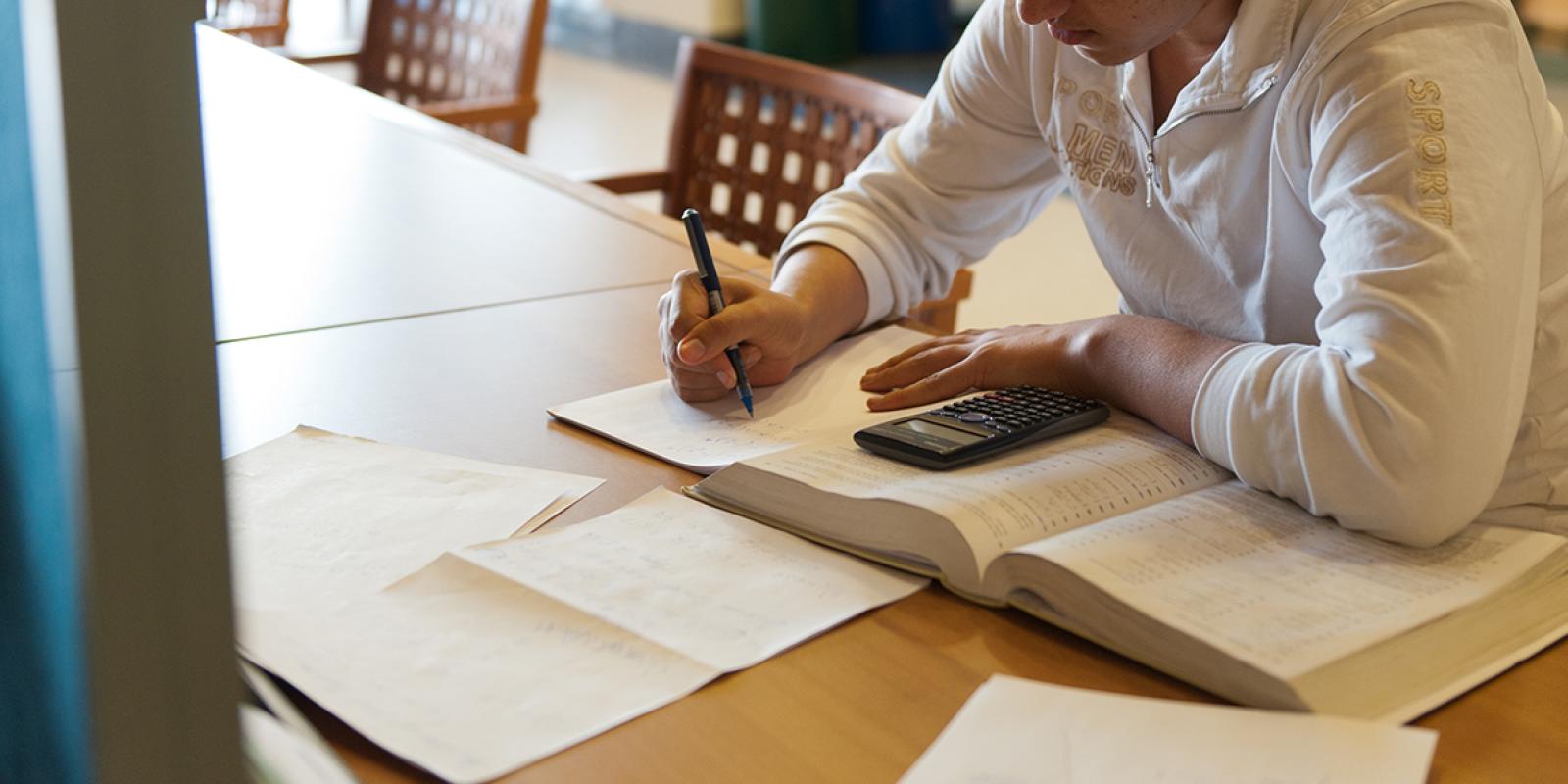 student in library