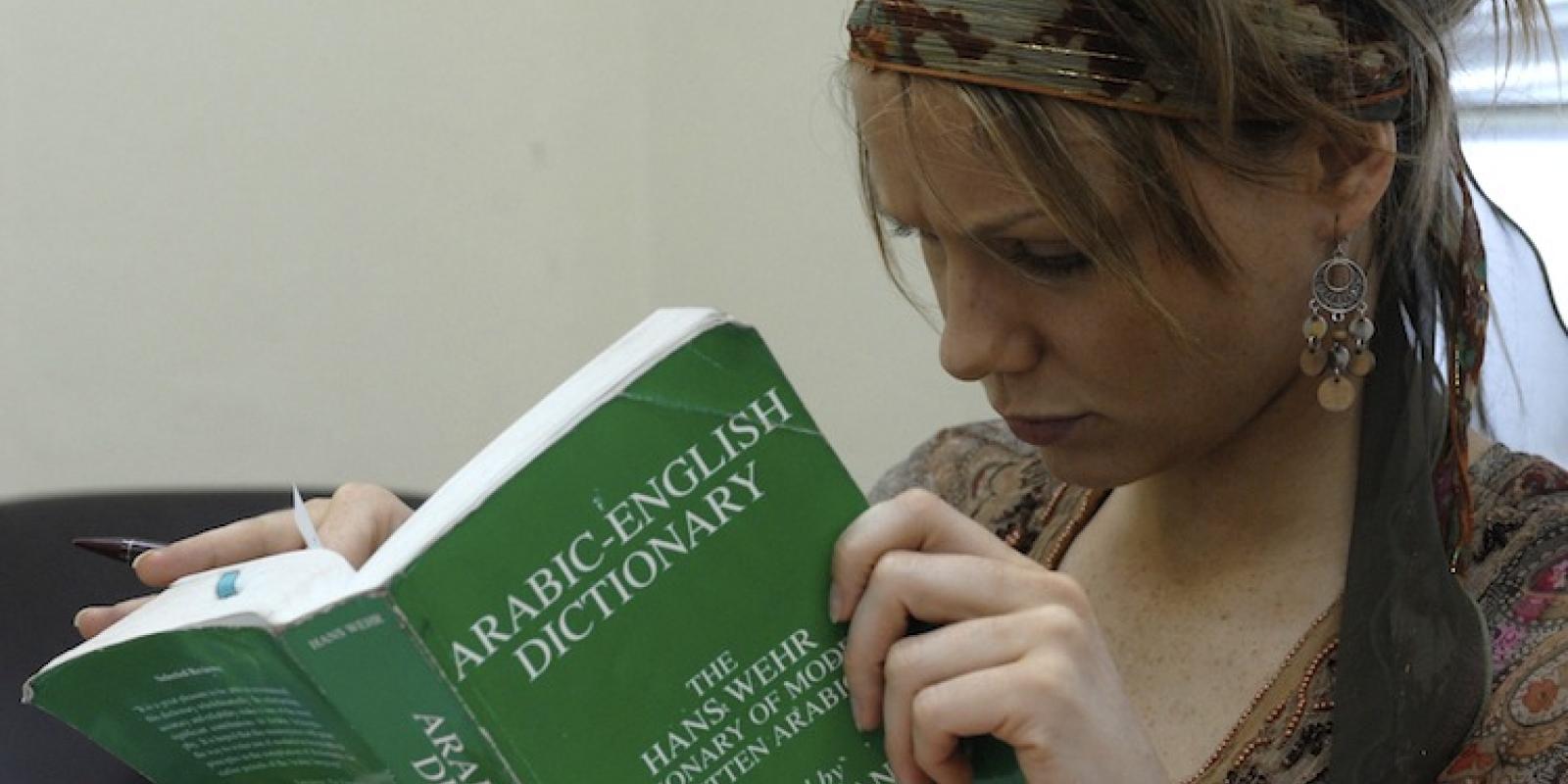 AUC student reading a book