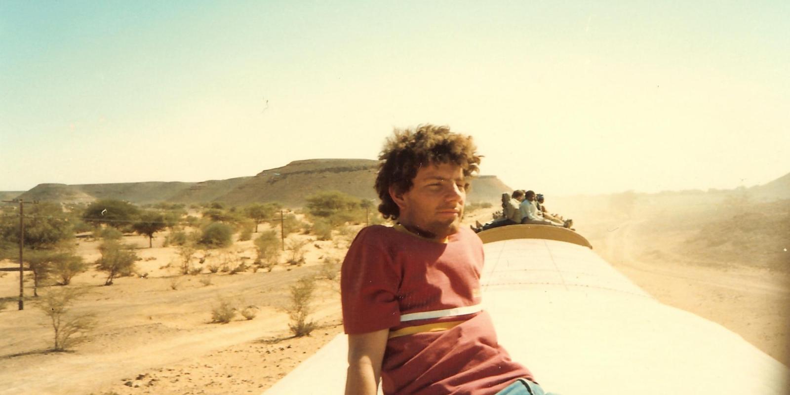 Nicholas Kristof on a train in northern Sudan during AUC's winter break