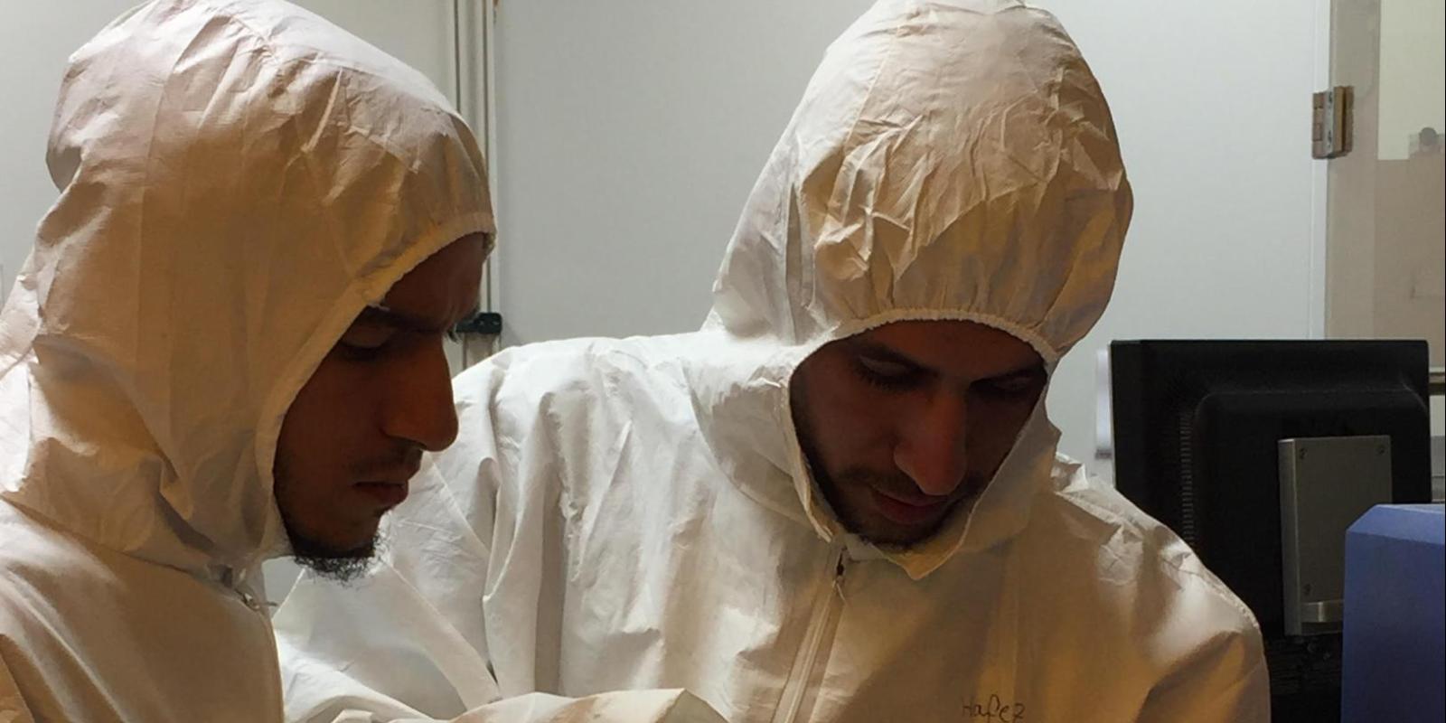 Graduate students Ahmad Amer and Ahmed Hafez work in the lab as part of Nageh Allam's team researching solar cell technology with their MIT counterparts