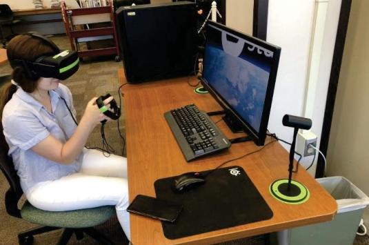Nour-Lyna Boulgamh using VR goggles in her design research