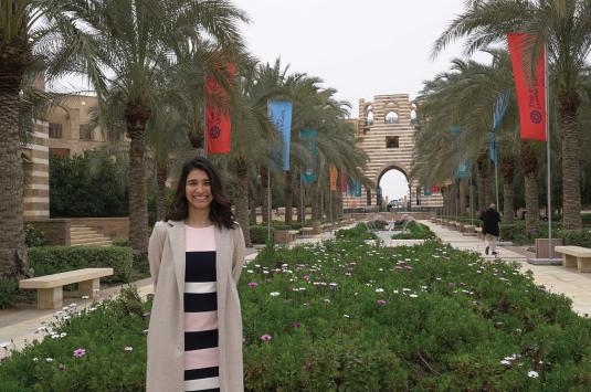 Girl standing in the middle of a garden