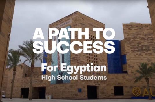 A photo of campus with the text "A path to success for Egyptian high school students"