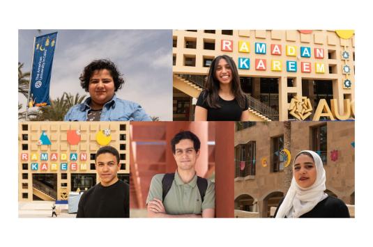 A collage of four students standing next to their Ramadan designs on campus. In the top right, a female student stands next to her banner design, on the top left, a girl smiles in front of the library facade with her AUC and Ramadan Kareem signs on the front. On the bottom left, a male student stands next to his library with his AUC design with the "C" as a crescent. On the bottom right, a female student stands next to her geometric designs strung between the trees. In the center bottom a male student.