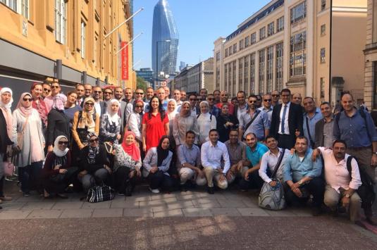 Members of the LEP program pose in a street