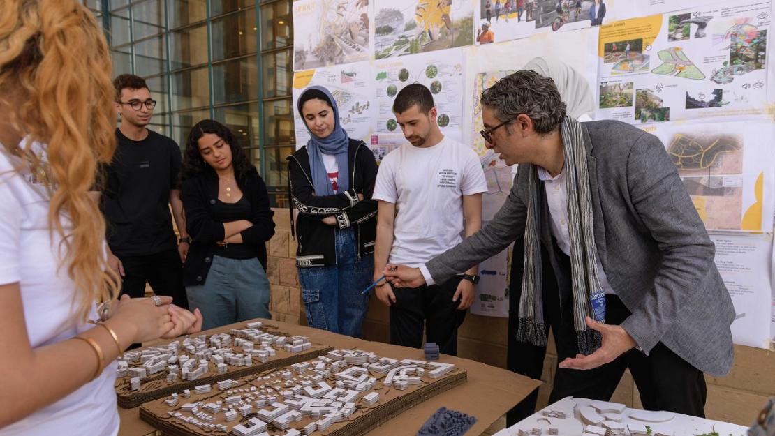 Professor explaining about buildings to students