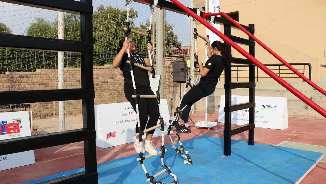 Students climbing ladders