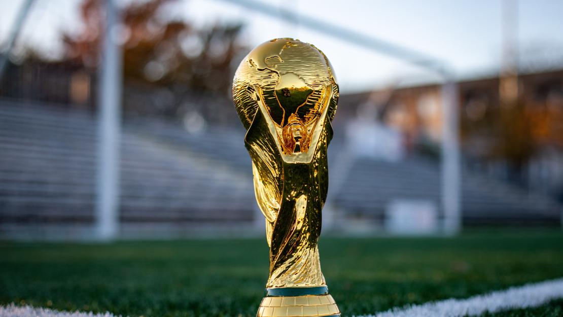 World cup trophy on a football field