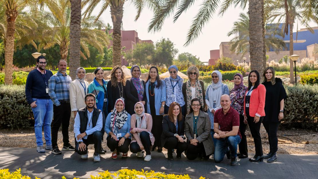 Group of people posing in the AUC Gardens