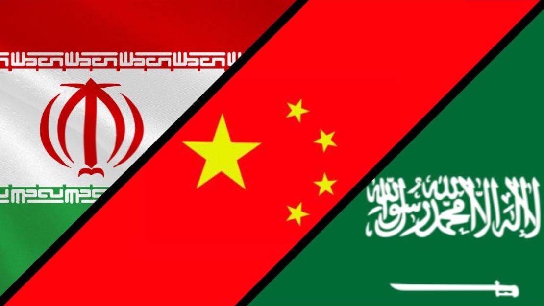 Three flags cut diagonally across the image, the Iranian flag in the top right corner, the Chinese flag through the middle, and the Saudi Arabian flag in the bottom left hand corner. Each flag is separated by a black bar. 