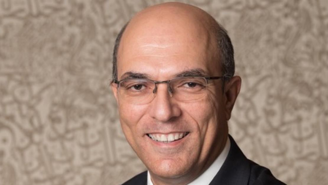 Dean Sherif Kamel smiling to the camera